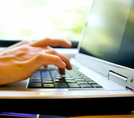 Woman Typing on Computer